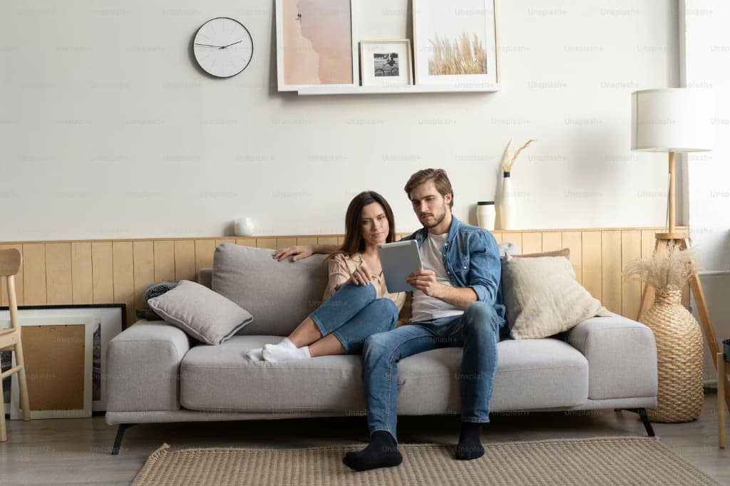 Two partners reviewing something together at home